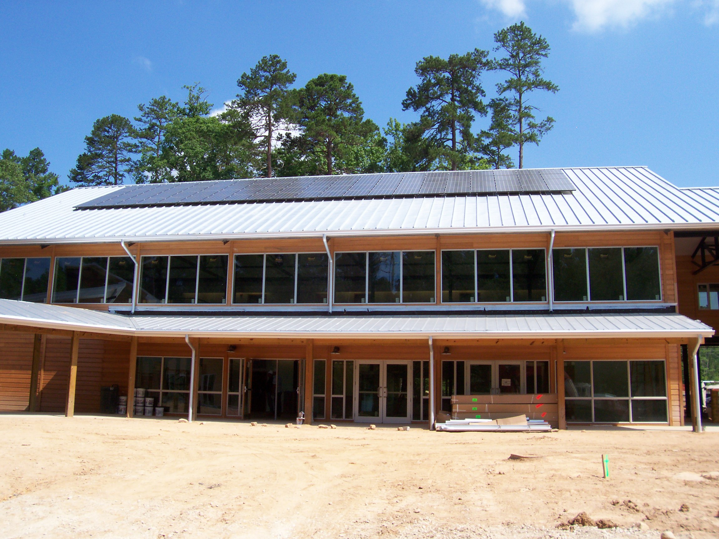 Modern timber building with rooftop solar panels