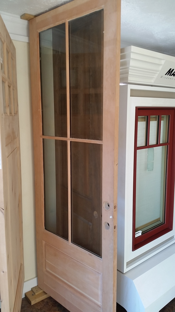 Unfinished wooden interior door with glass panes