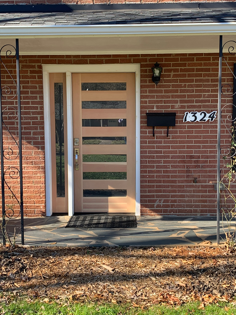 Modern beige front door with horizontal glass panels