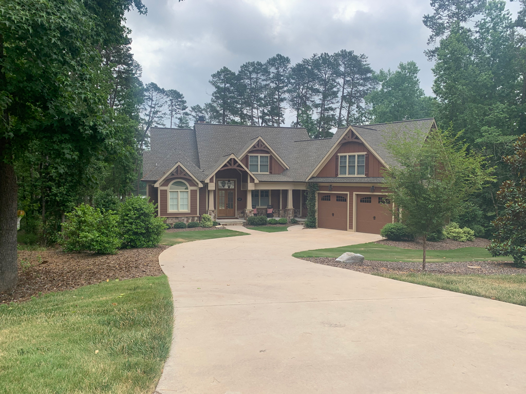 Suburban house with curved driveway and garage