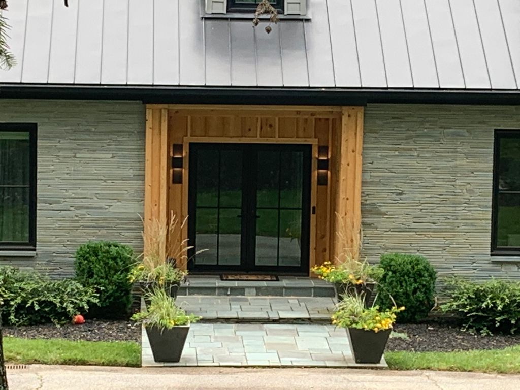 Modern house entrance with double glass doors