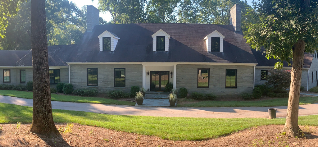 Single-story brick house with dormers