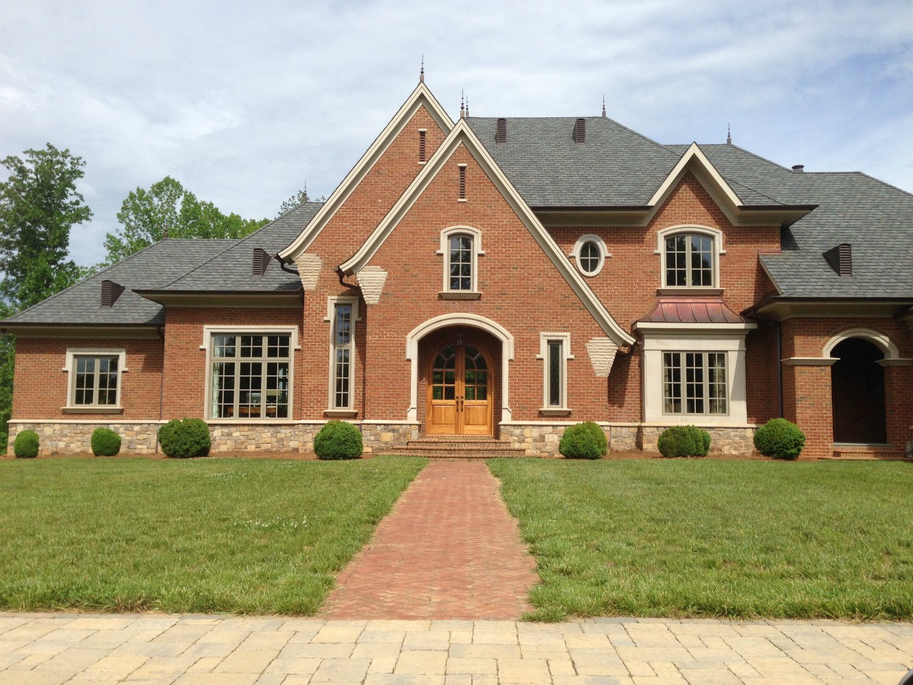 Large red brick house with front walkway