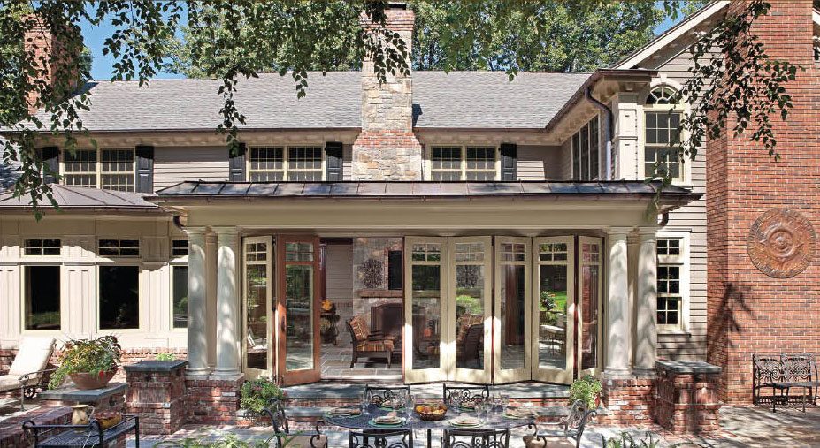 Brick house patio with glass doors and columns