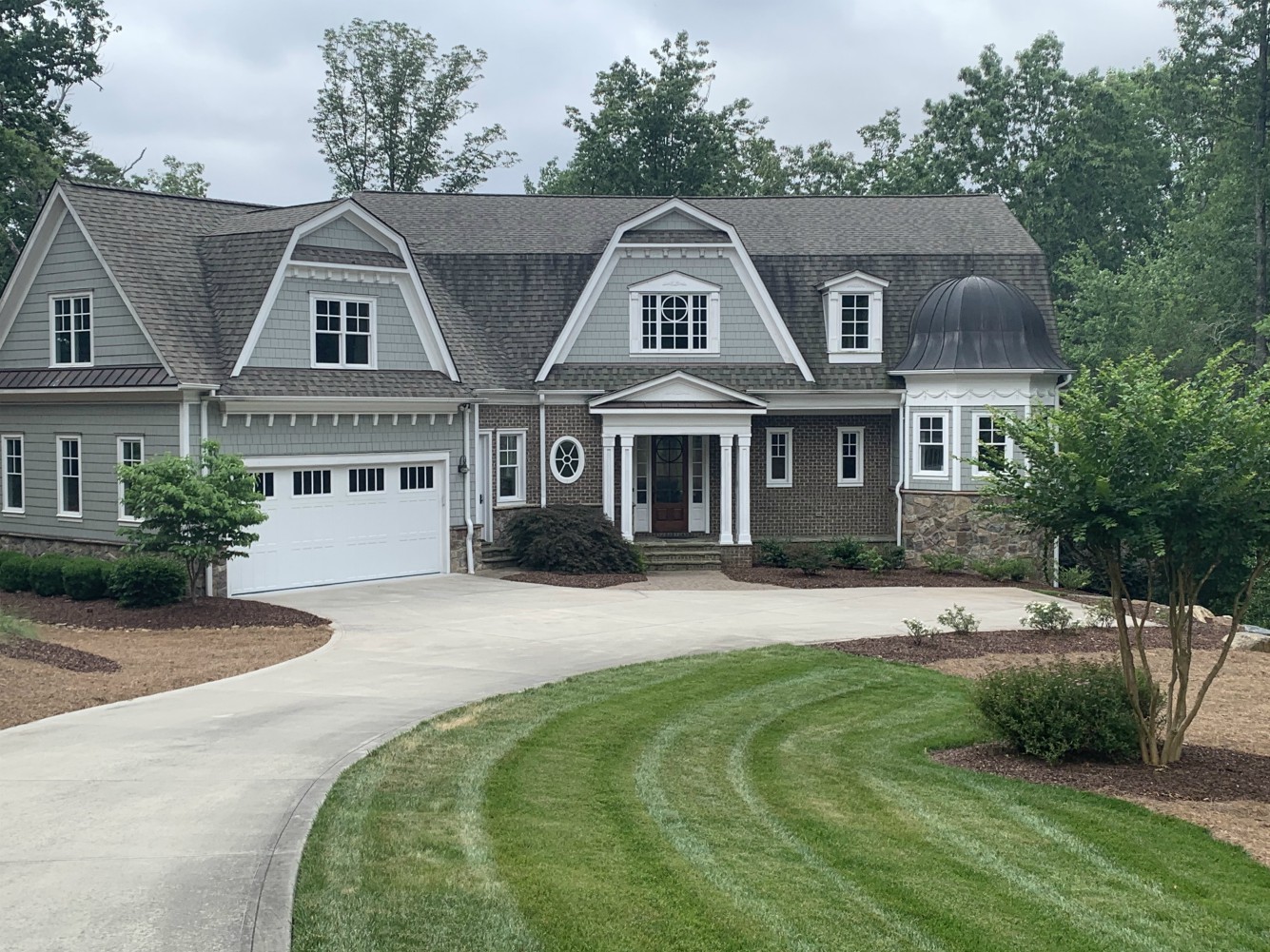 Large suburban house with curving driveway