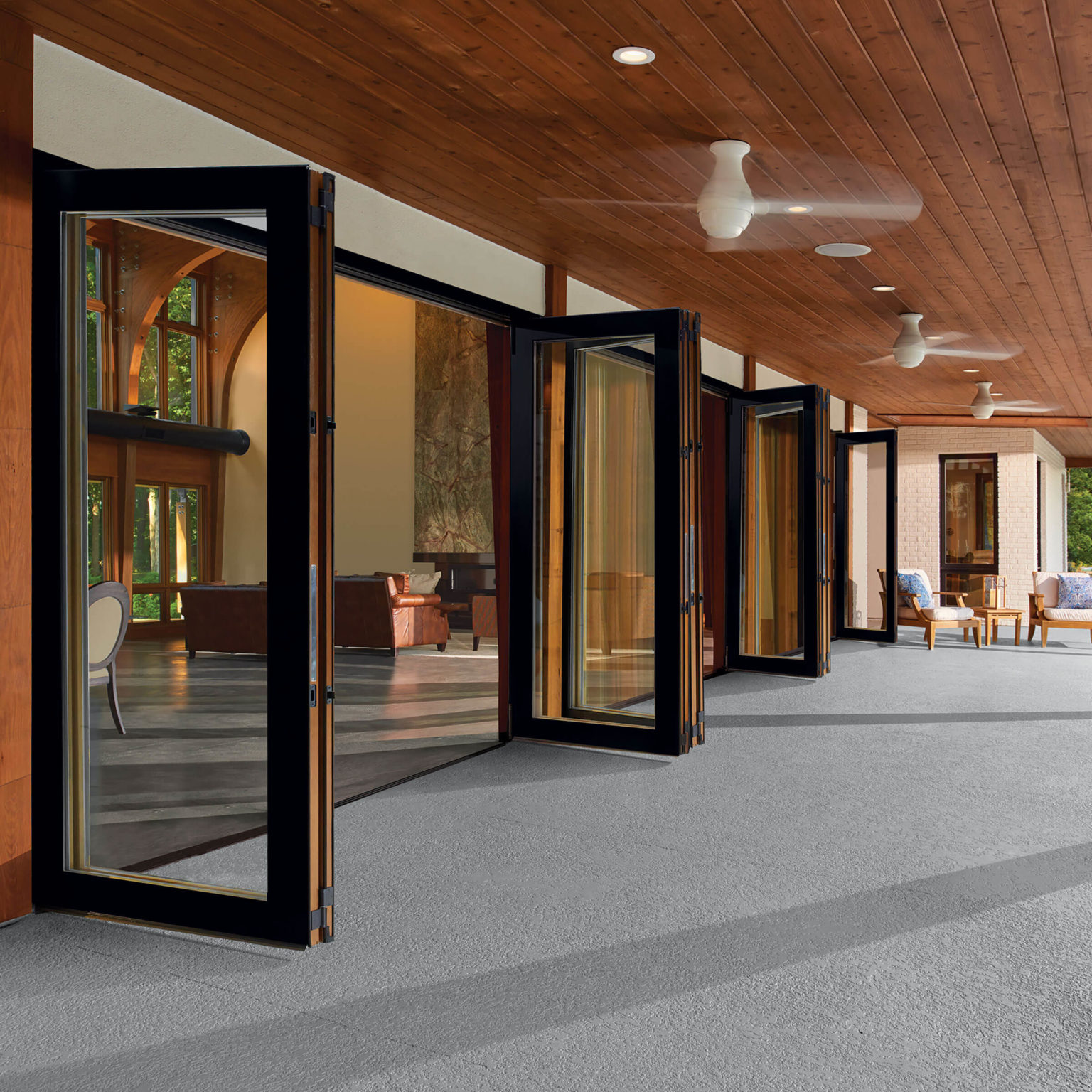 Modern covered patio with folding glass doors